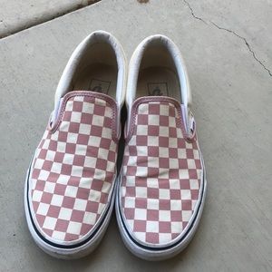 Pink checkered slip on vans.